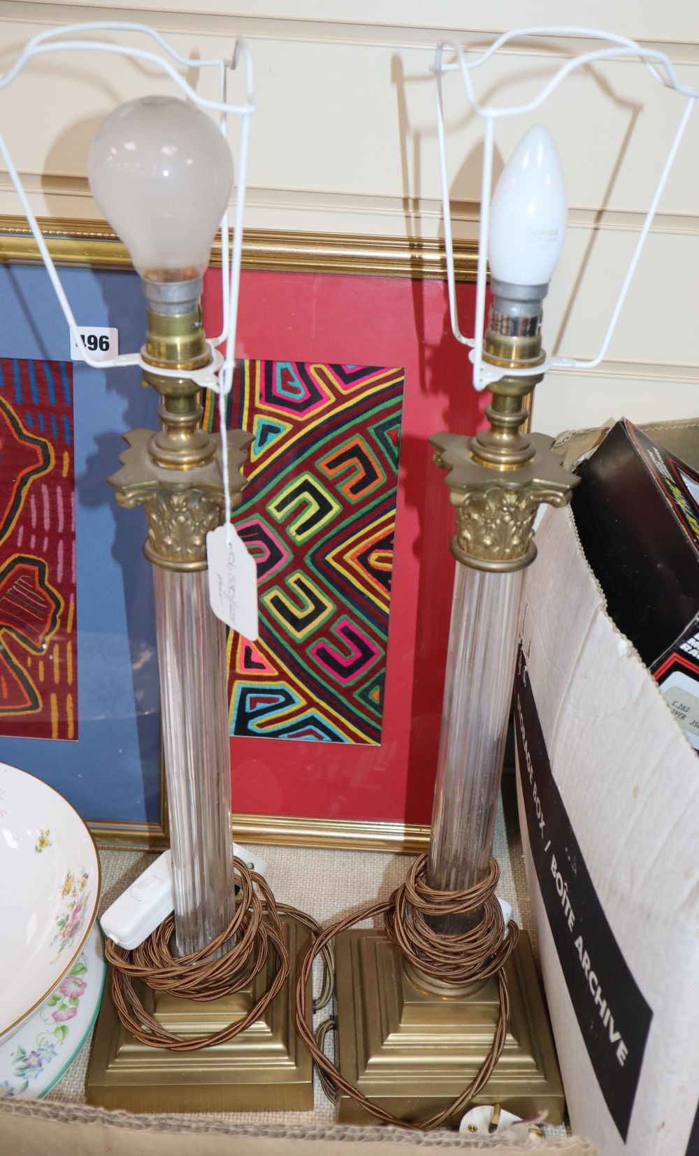 A pair of brass mounted glass stemmed table lamps